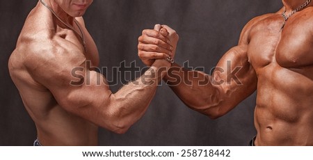 Hello athletes. Two bodybuilders shake hands