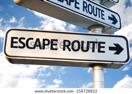 Escape Route direction sign on sky background