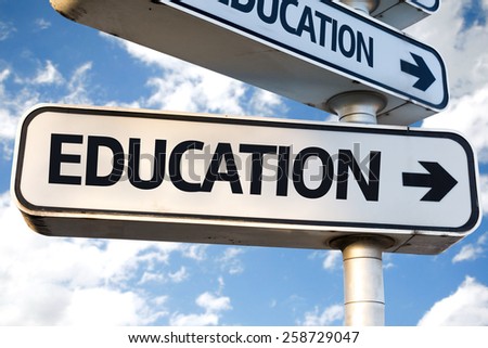 Education direction sign on sky background
