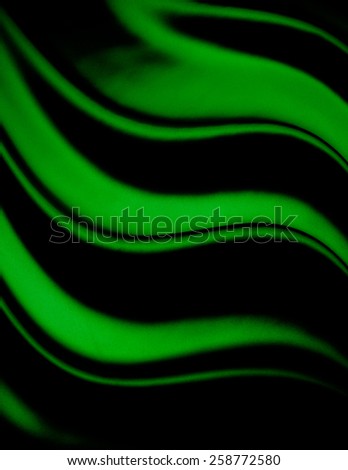 abstract background luxury cloth or liquid wave or wavy folds of grunge green silk texture satin velvet material or luxurious