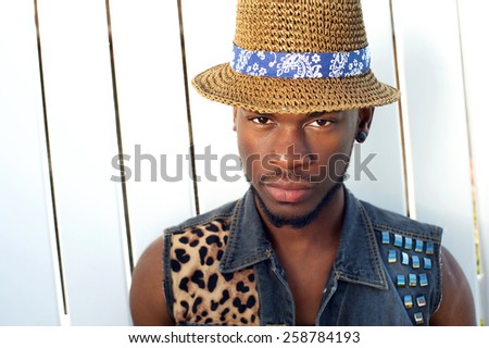 Close up portrait of a handsome young african american man with hat
