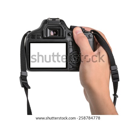 DSLR camera in hand isolated Royalty-Free Stock Photo #258784778