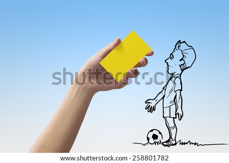 Caricature of football player and human hand showing yellow card