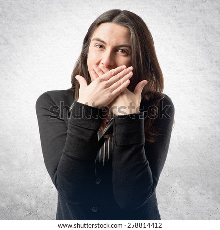 Women with her mouth closed by her hands 