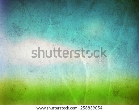 Concept or conceptual green fresh summer or spring grass field over a blue sky background on a vintage old paper, metaphor to nature, season, rural, outdoor, environment, pasture, growth conservation