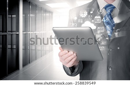 Business man using tablet PC in office