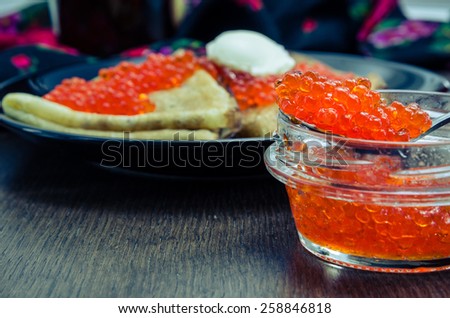 		 spoon large red caviar closeup