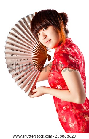 Chinese model in traditional Cheongsam dress with slit, holding fan. Asian cute girl, young model with a variety of facial expressions and poses. 