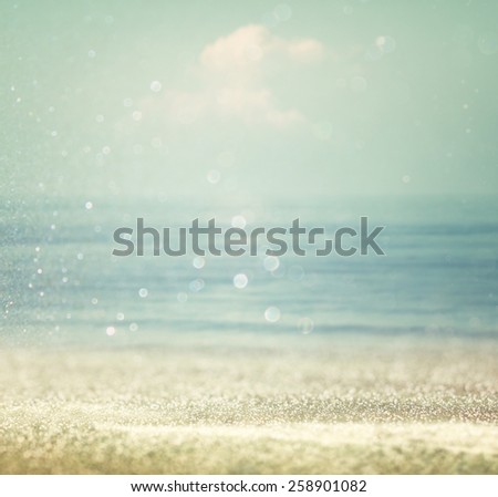 background of blurred beach and sea waves with bokeh lights, vintage filter. 