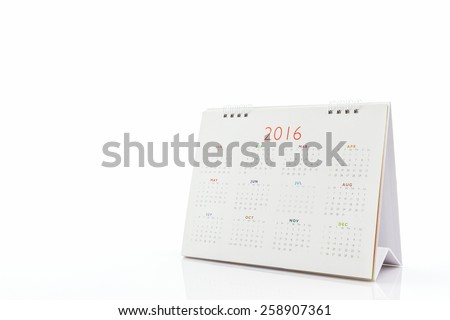 White paper desk spiral calendar 2016 on white background.
