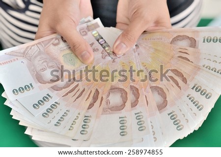 Hand with money . Concept of happiness, success, celebrate, excited good perfect great glad cool.