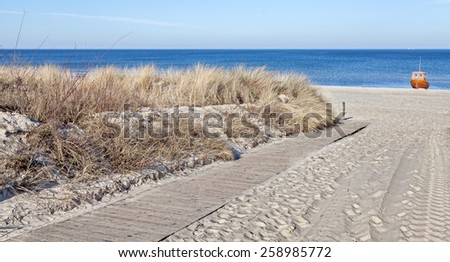 Panoramic picture of path on a beach.