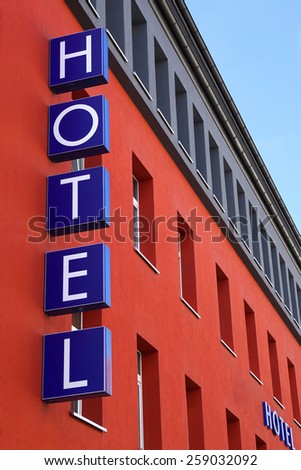colorful modern facade with hotel sign                               