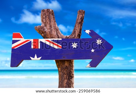 Australia Flag wooden sign with a beach on background