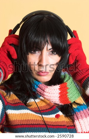 beautiful woman listening music in headphones
