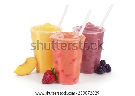 Three Fruit Smoothies or Shakes with Straws and Garnishes on a White Background Royalty-Free Stock Photo #259072829