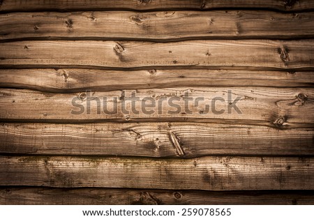 wooden wall background with black vignette borders  Royalty-Free Stock Photo #259078565