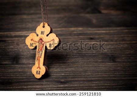 Closeup picture of small wooden christian cross