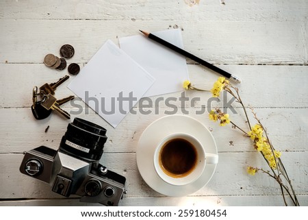 Vintage still life details, cup of coffee,paper note and pencil