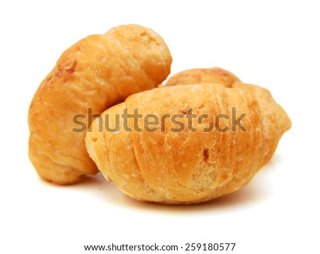 Fresh and tasty buns with raisins over white background