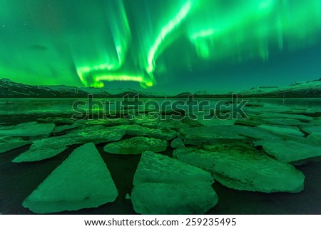 Northern lights (Aurora borealis) reflection across a lake in Iceland.Contains Noise.

 Royalty-Free Stock Photo #259235495