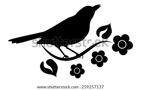 Silhouette of bird sitting on branch with flowers