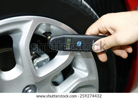 automobile tire pressure control Royalty-Free Stock Photo #259274432