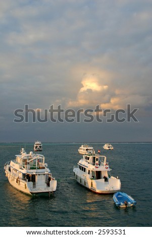 motor boats with cloudscape background