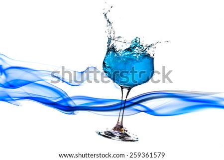 Drinking water out of a glass pestle skylark on a white background.