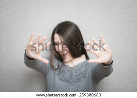 pretty young girl requiring stop with her hands