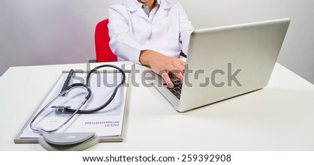 Medical doctor working with computer in the office.