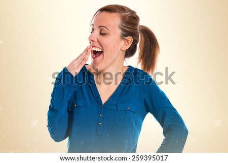 Woman yawning over white background 