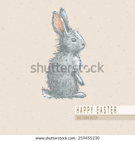 Hand drawn colored sketch of easter rabbit. Vector vintage line art illustration on texture paper.  
