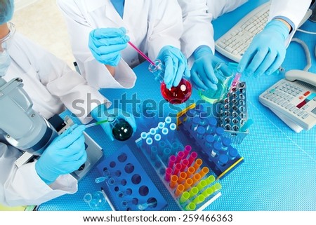 Group of medical doctors in laboratory. Scientific research. Royalty-Free Stock Photo #259466363
