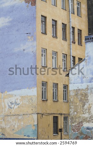 End Side Walls of Old Buildings and a Graffiti picturing flying birds.