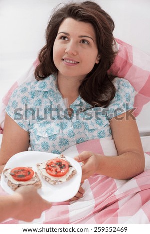 Young hospital patient gets a tasty breakfast