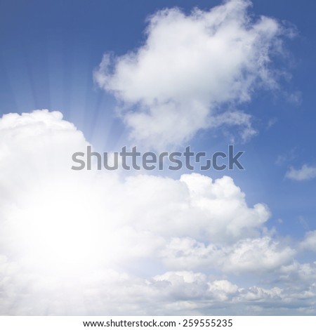 Blue sky with clouds with sun burst