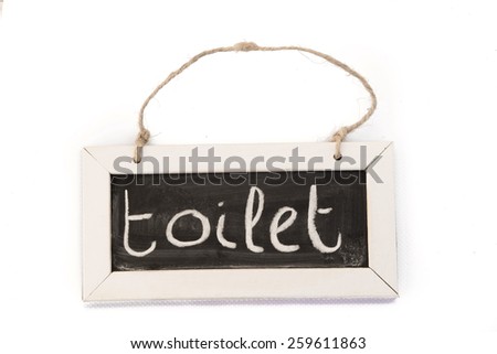 blackboard on rope 'toilet'