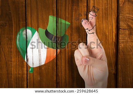 Patricks Day fingers against overhead of wooden planks