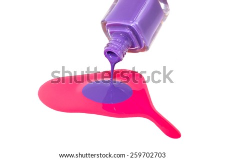 Purple nail polish pouring on the pink nail polish isolated on the white background