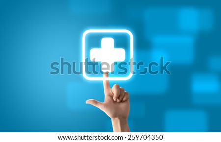 Close up of human hand pushing application icon