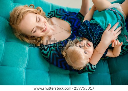 Happy mother and daughter hugging and laughing