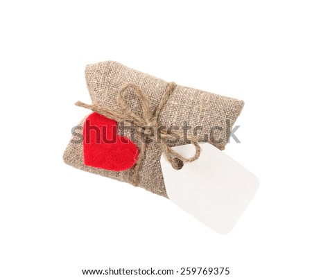 vintage gift in sacking with heart and tag, isolated on white