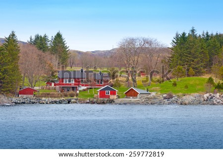 Traditional Norwegian small village with colorful wooden houses on the seacoast