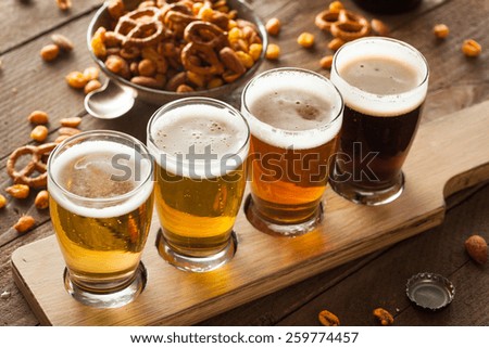 Assorted Beers in a Flight Ready for Tasting Royalty-Free Stock Photo #259774457
