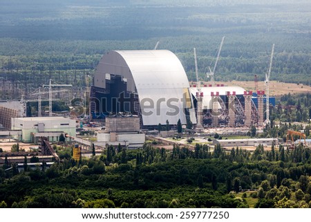 Chernobyl nuclear power plant. Chernobyl arch. Chernobyl new safe confinement. Chernobyl power plant from the air. Chernobyl reactor 4. Chernobyl sarcophagus. Chernobyl object Shelter Royalty-Free Stock Photo #259777250