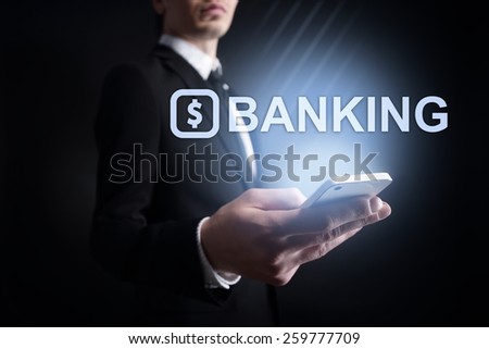 businessman holding a mobile phone with banking text. Internet concept. business concept. 