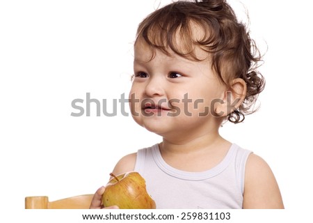 The child eats a apple.