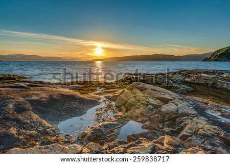 Midnight sun near Alta in Finnmark, Norway Royalty-Free Stock Photo #259838717