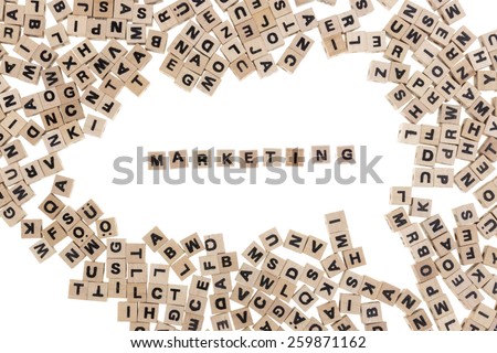 marketing framed by small wooden cubes with letters isolated on white background